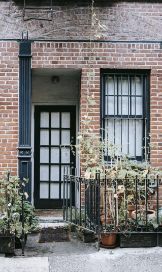 Porch of building with brick wall